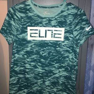 Nike Elite Youth tee shirt fits like a small.